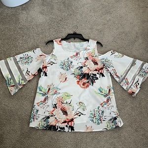 Beautiful floral cold shoulder blouse.